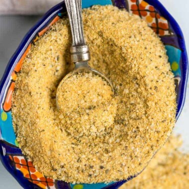 overhead closeup of adobe seasoning in bowl with small spice spoon