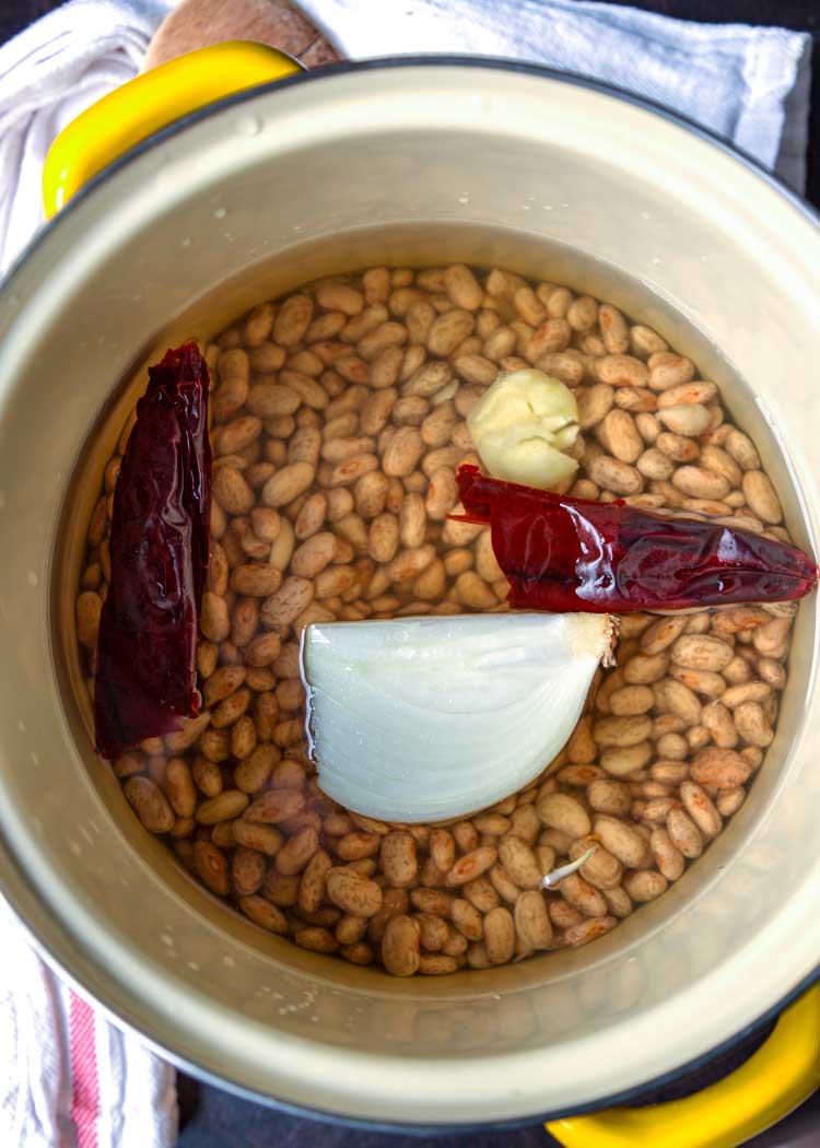 Authentic Refried Beans in a pot with onions