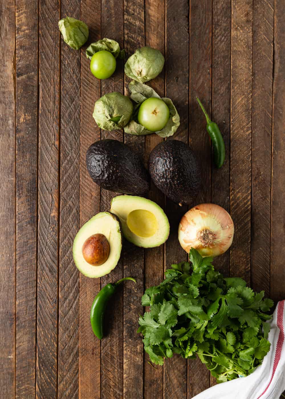 fresh avocados, tomatillos, onion and jalapeno to make guacamole salsa