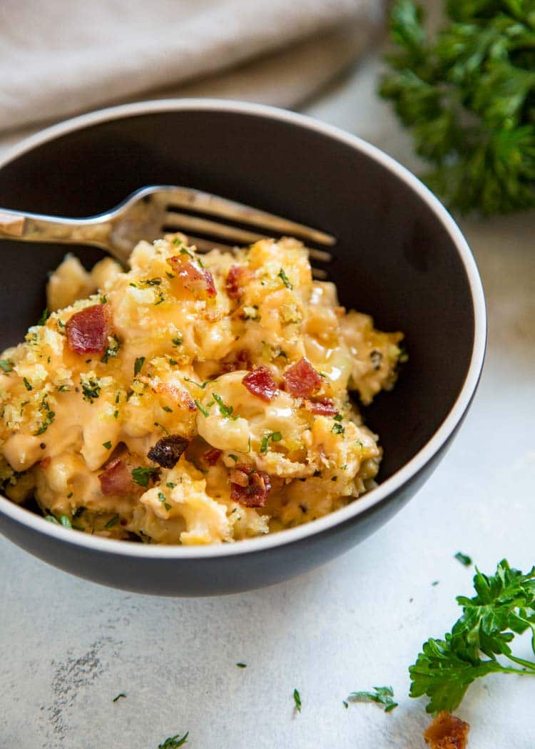 My Bacon Mac and Cheese Casserole is loaded with crisp bacon, cheddar, mozzarella and cream cheese. Topped with buttery Panko breadcrumbs. Pasta perfection! keviniscooking.com