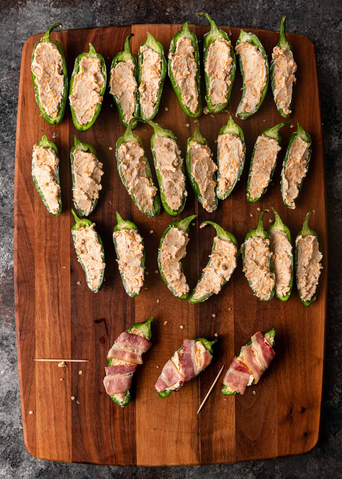 adding filling to jalapenos