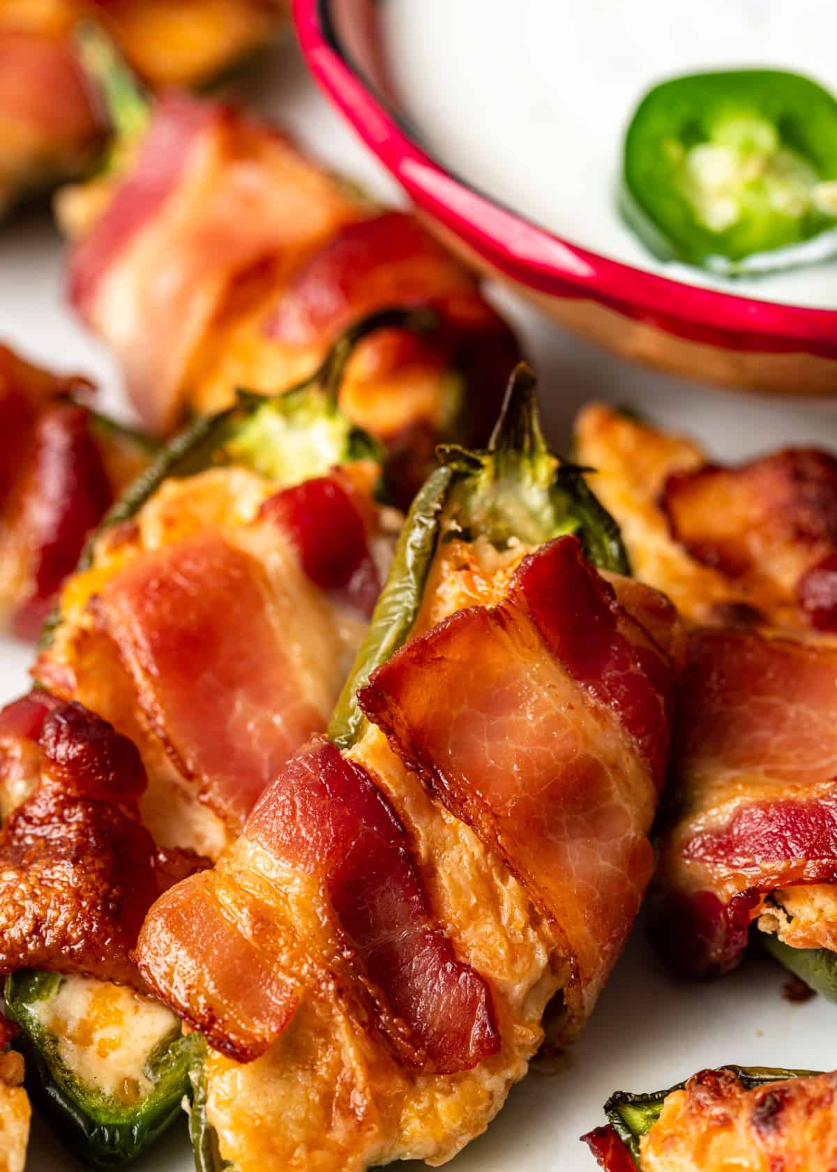 platter with Bacon Wrapped Jalapeño Poppers and dipping sauce