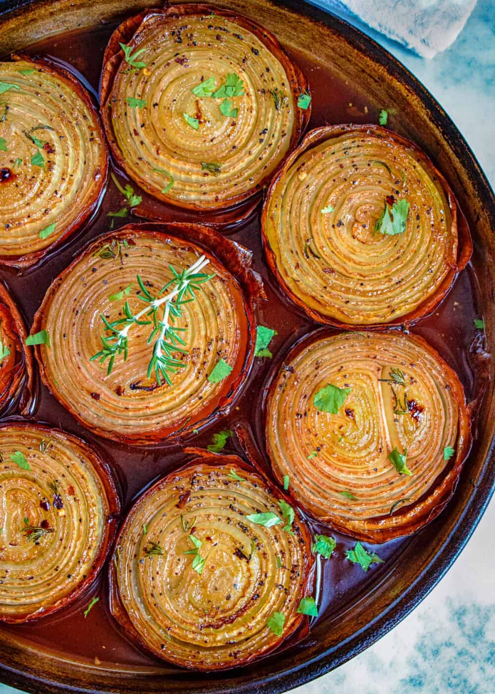 overhead: baked onions in round casserole dish