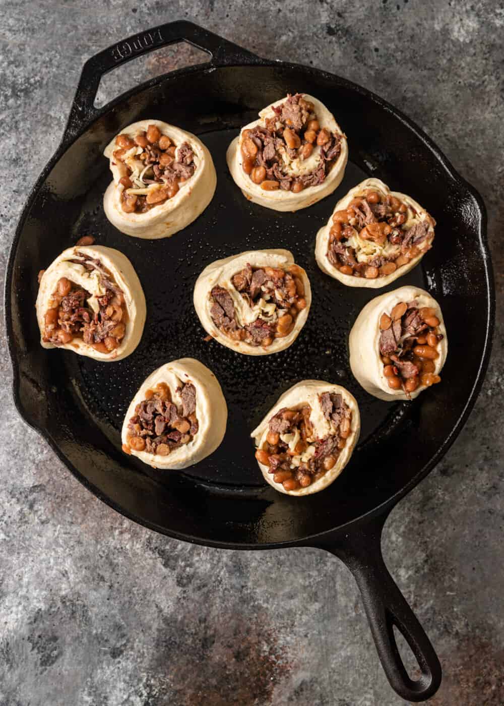 cut side down of beef rolls in skillet