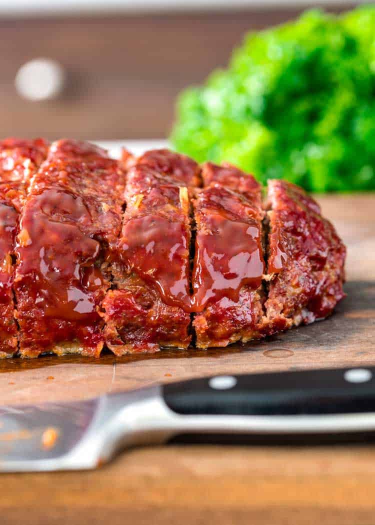 BBQ Smoked Meatloaf slice on wood cutting board