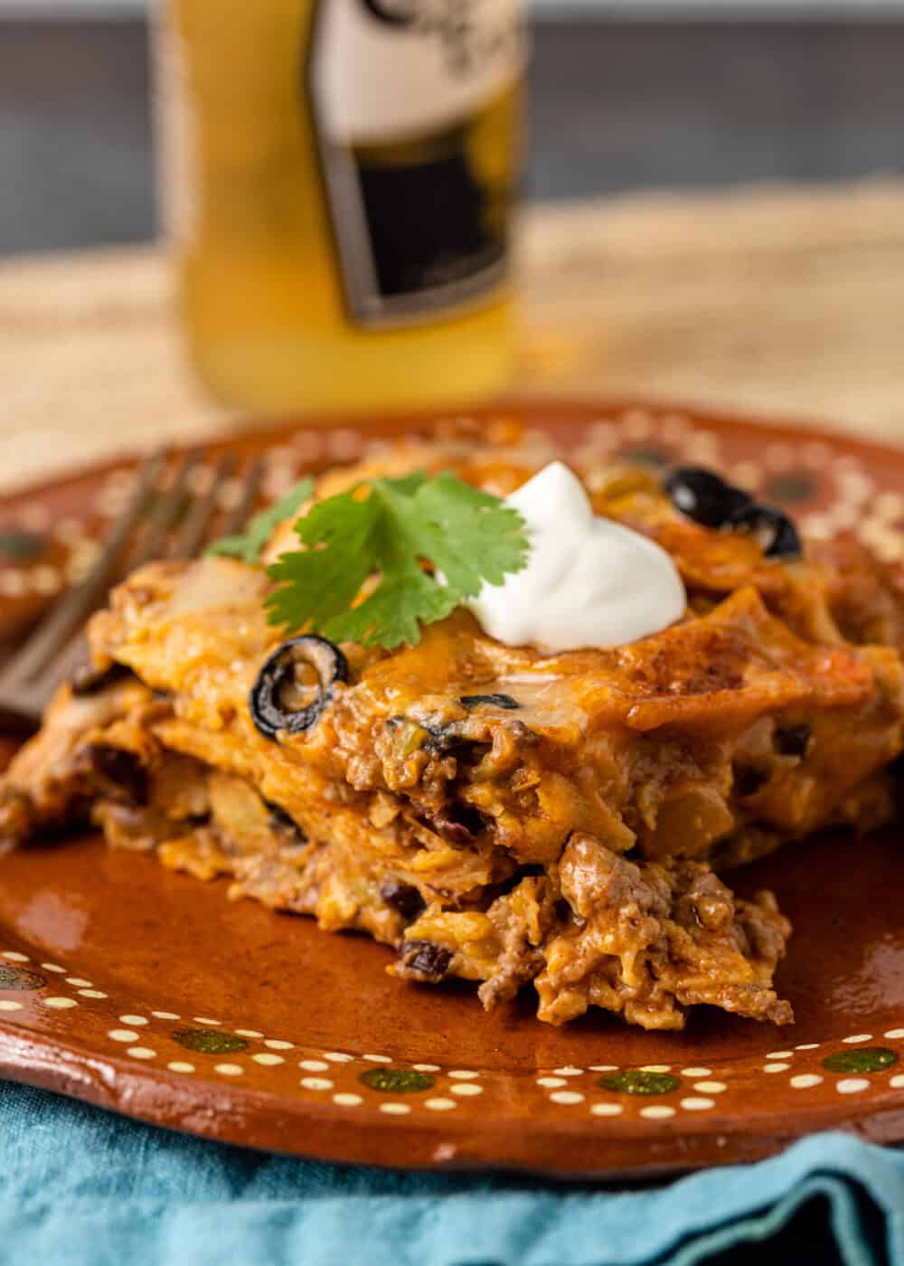 side view: slice of enchilada casserole on plate