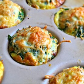 A plate of food, with Egg and Sausage cups