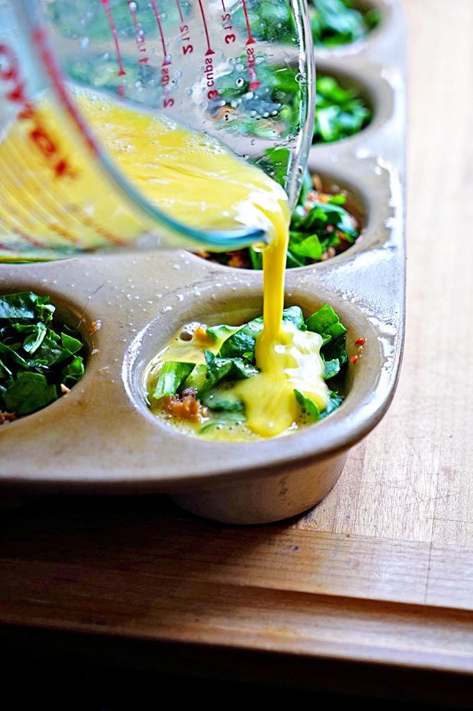 pouring eggs in muffin pan