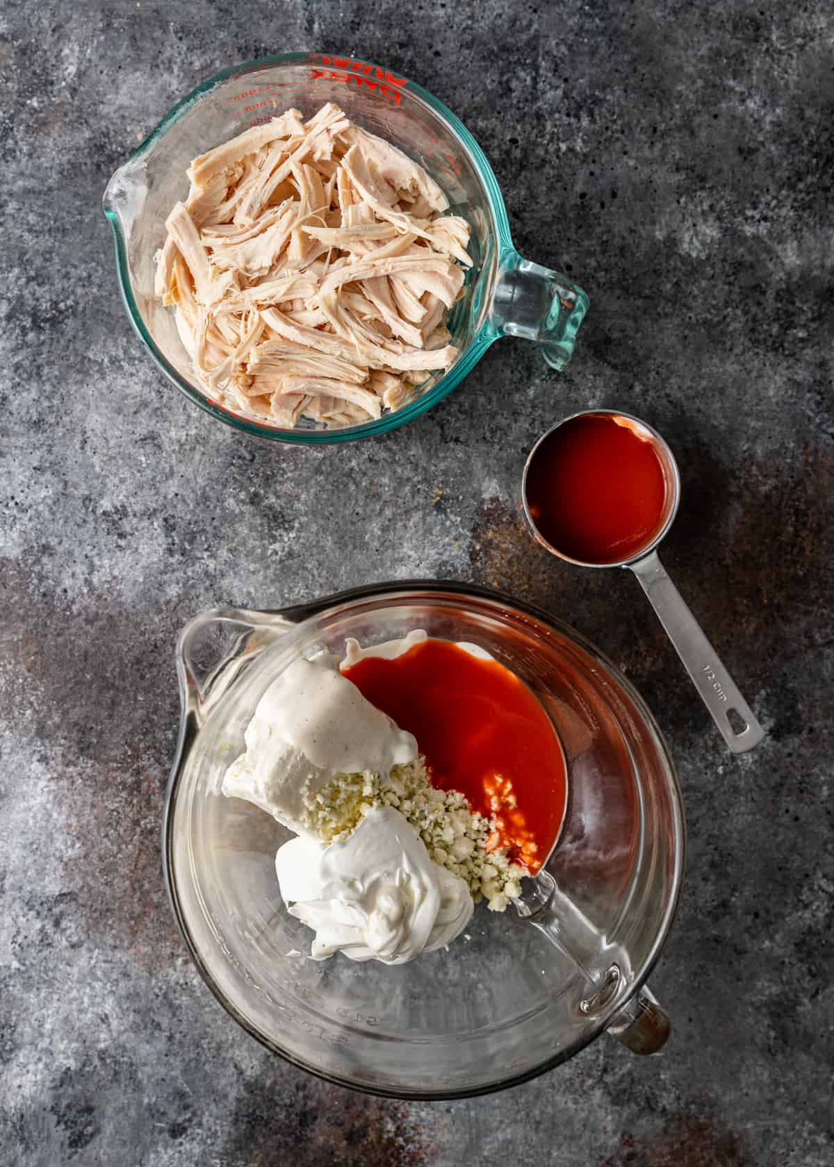 adding ingredients to large bowl