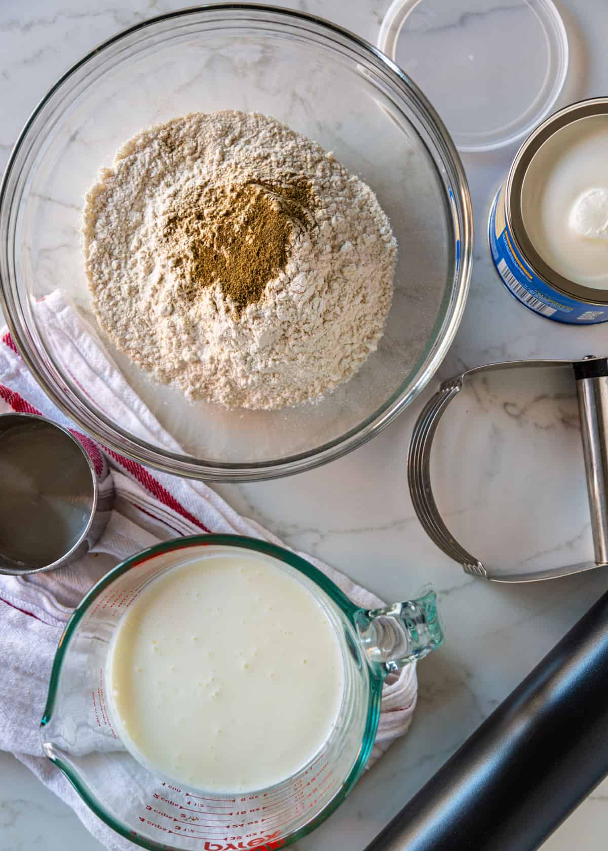 flour and seasoning in bowl with buttermilk