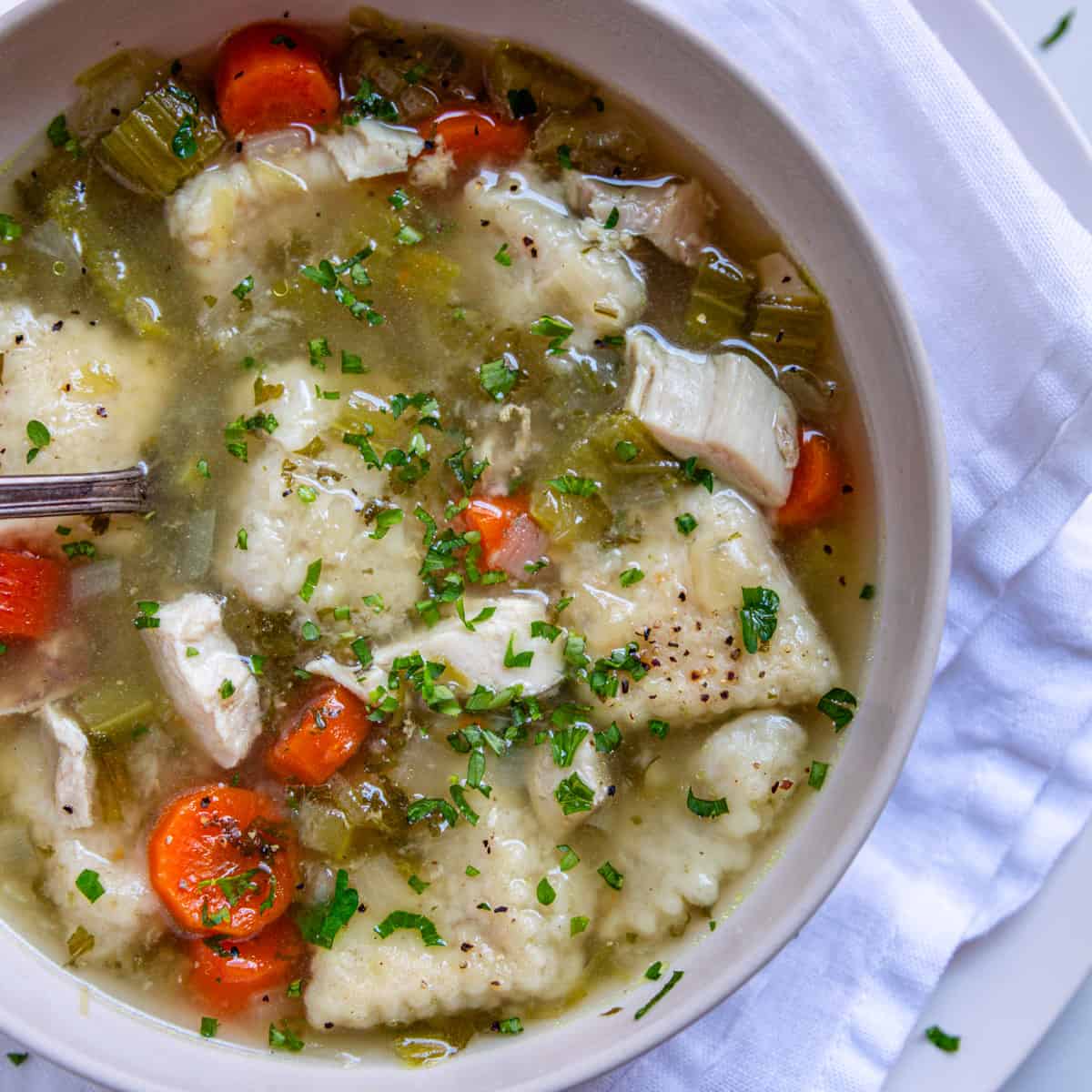 buttermilk dumplings in chicken broth with vegetables