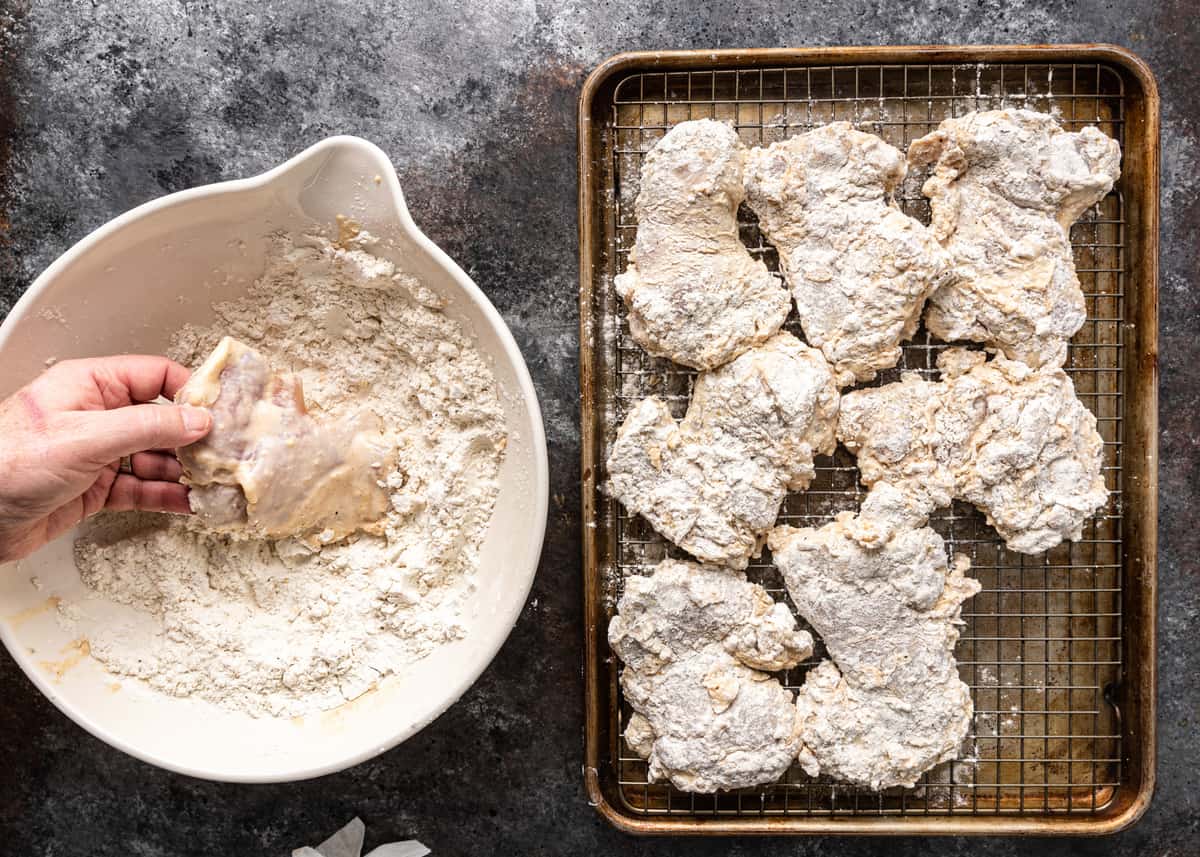 dredging chicken in flour mixture