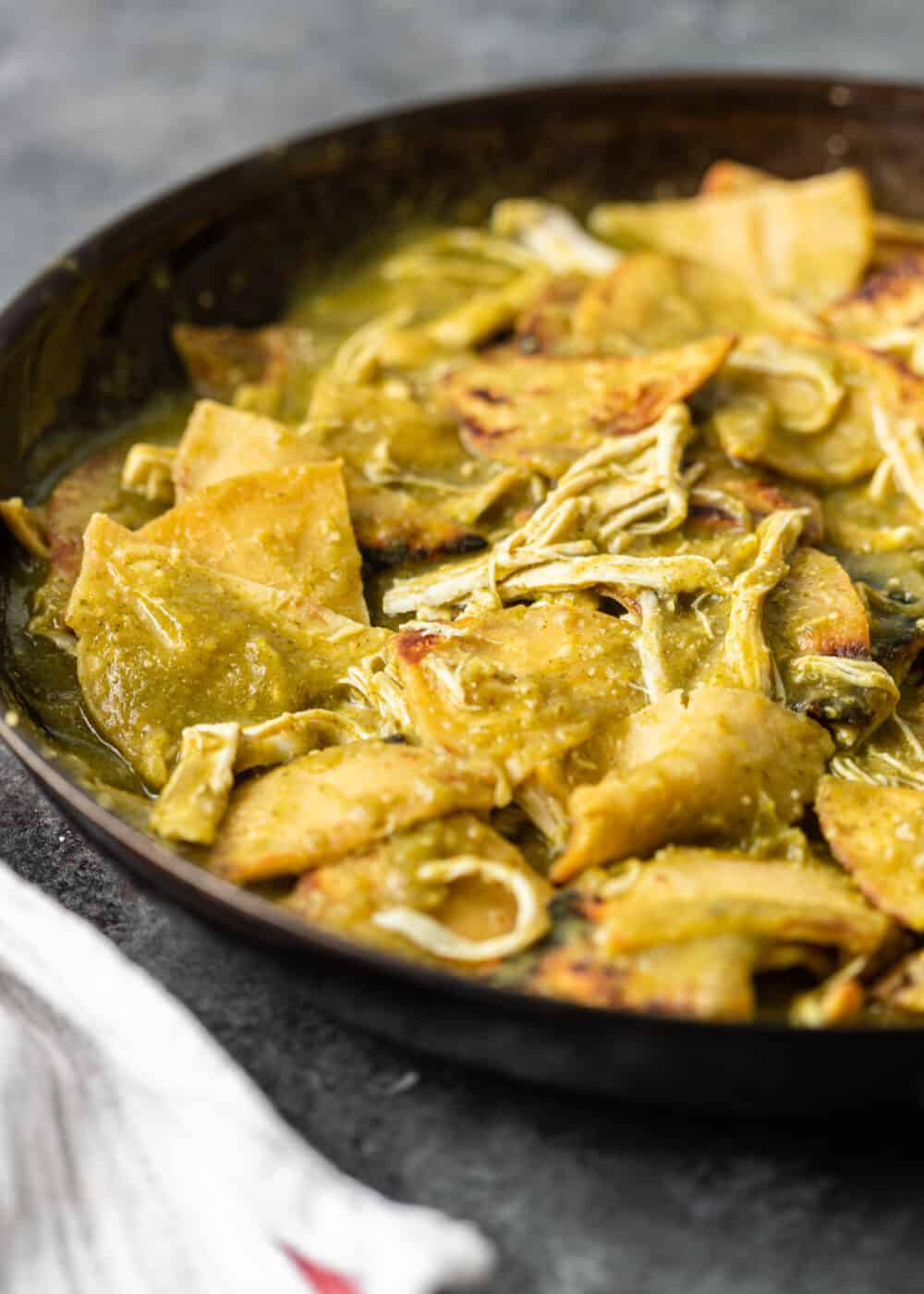 tortilla chips drizzled with salsa verde