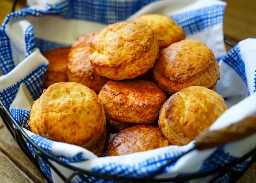 napkin lined basket of cheese biscuits