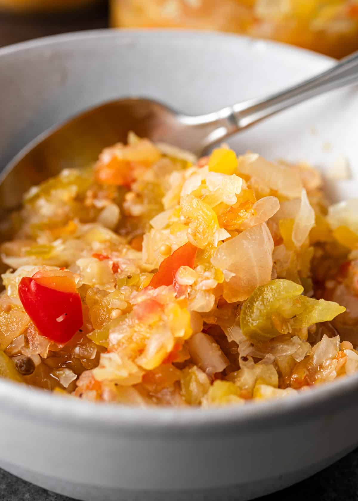 overhead extreme closeup: Chow Chow relish in a bowl with a spoon