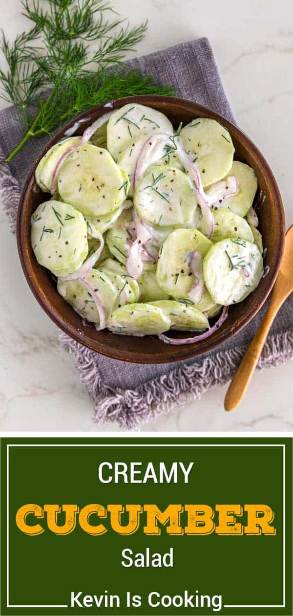 overhead of cucumber salad with creamy dill dressing in wood bowl