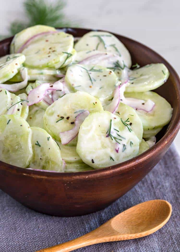 Classic Cucumber Salad in brown wood bowl