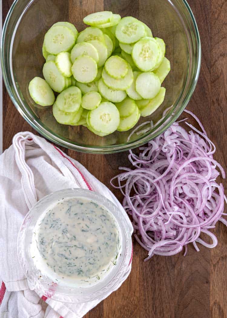 sliced cucumbers and red onions