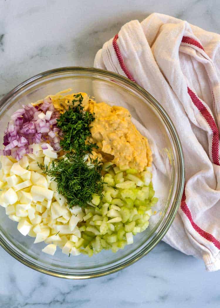 overhead photo of bowl of Classic Egg Salad ingredients