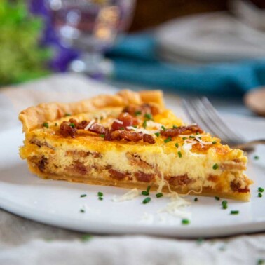 slice of Quiche Lorraine on a white plate