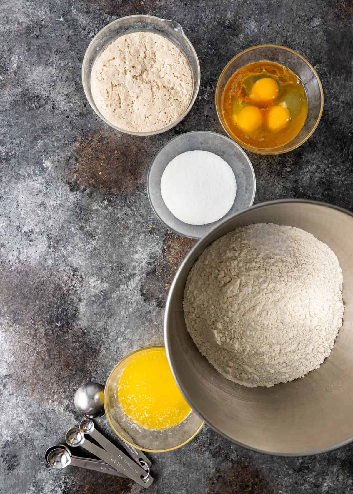 Conchas ingredients including flour, butter, sugar, and measuring spoons