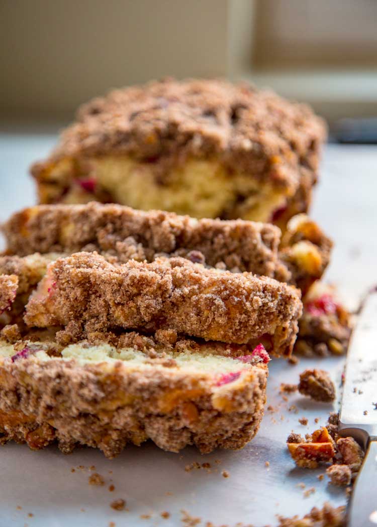 This tender Cranberry Nut Bread is the perfect way to wake up with a cup of coffee or tea. Loaded with cranberries and a crunchy cinnamon streusel topping. keviniscooking.com