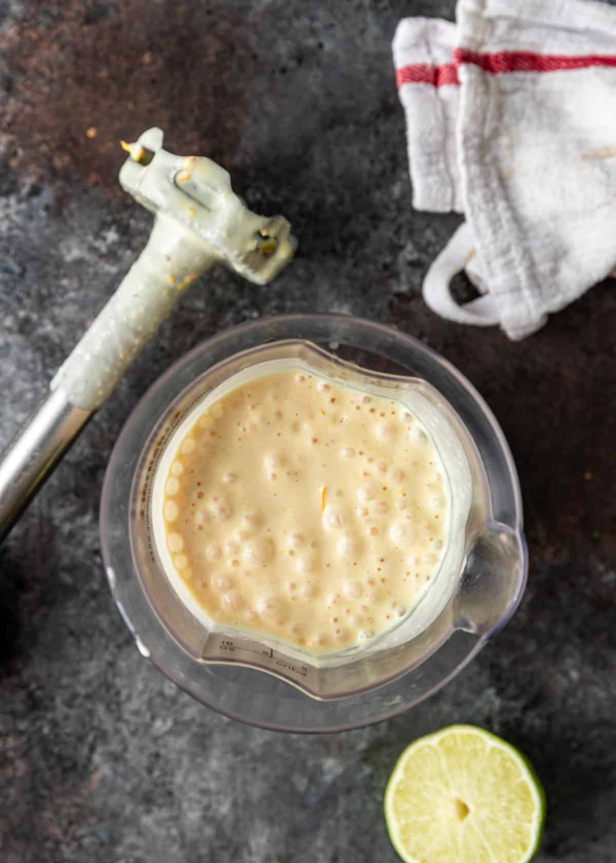 overhead: blended habanero sauce in an immersion blender cup with the blender visible