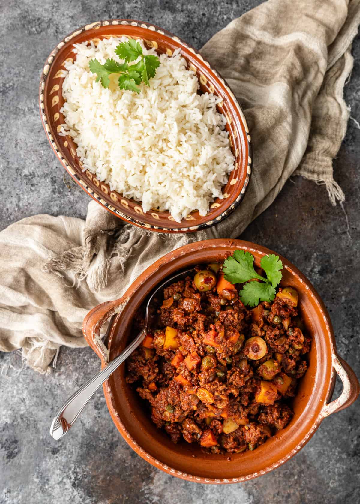 overhead: bowls of rice and Cuban picadillo