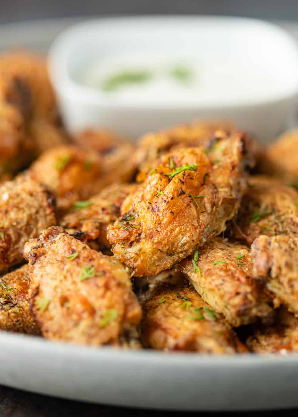 platter of oven baked crispy chicken wings with dill pickle marinade