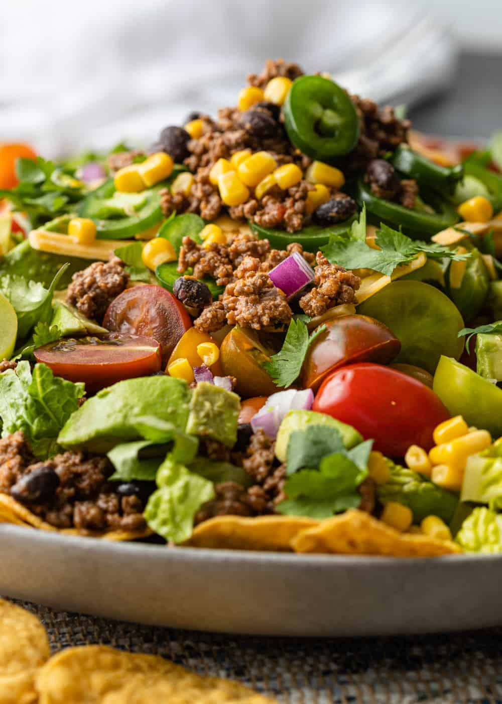 jalapeños, tomatoes, corn, avocado on romaine with taco meat