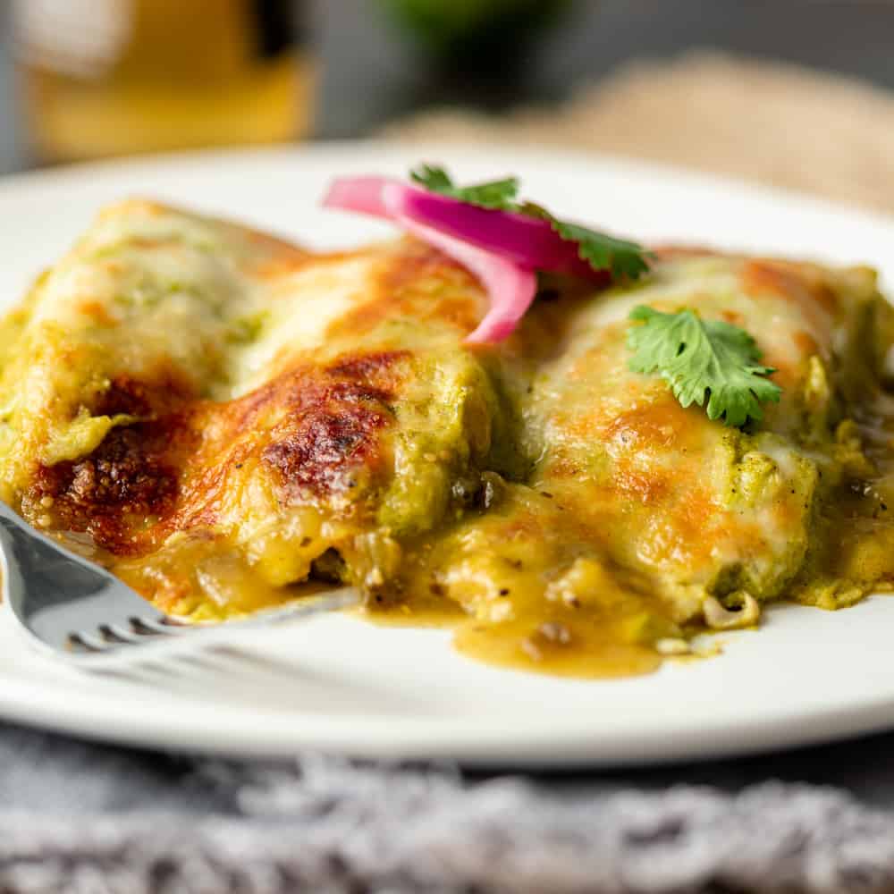 enchilada suiza on white plate