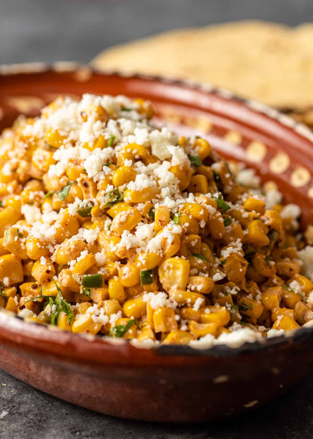 closeup: Mexican street corn salad with cotija cheese on top