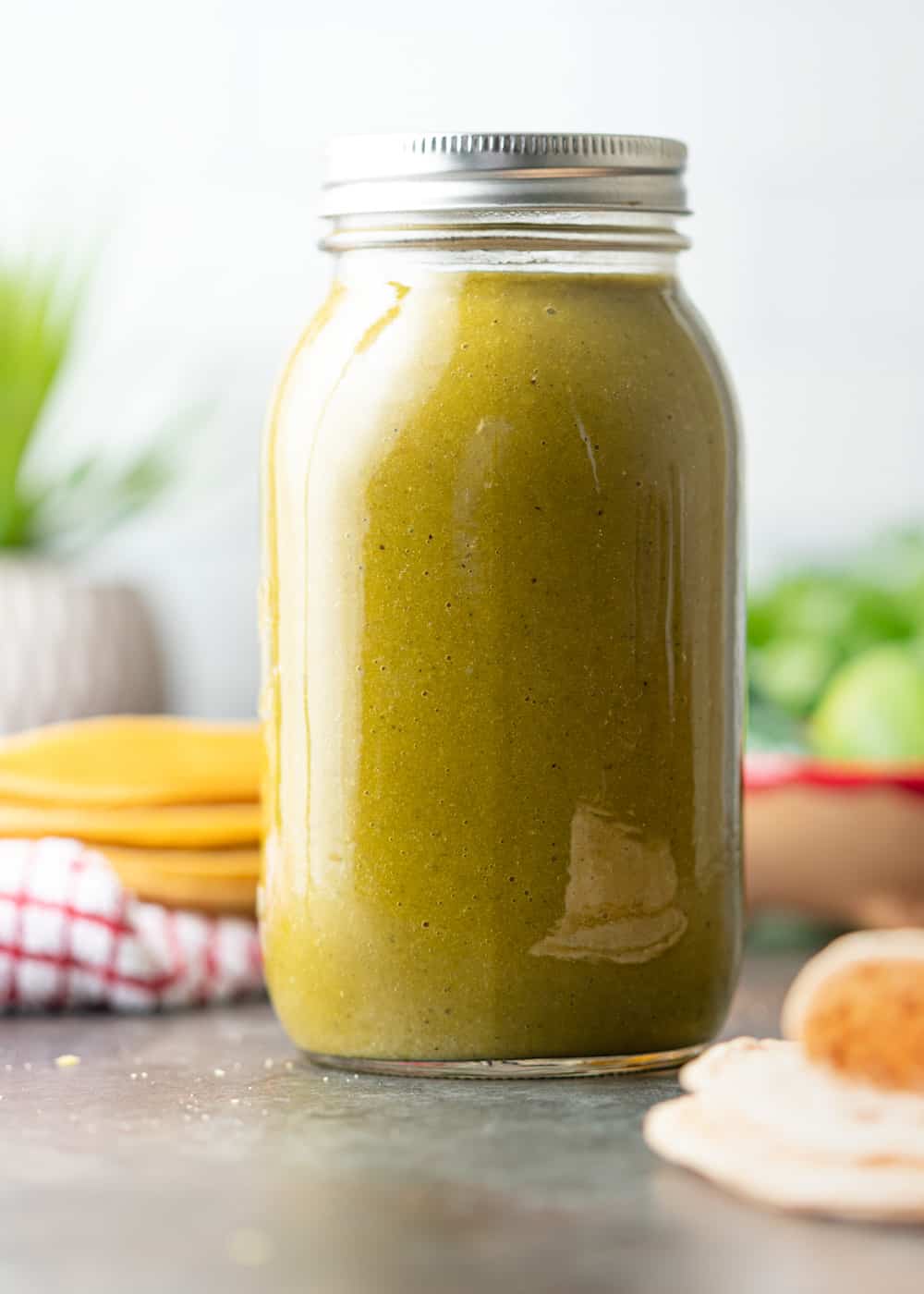 green enchilada sauce in tall mason jar