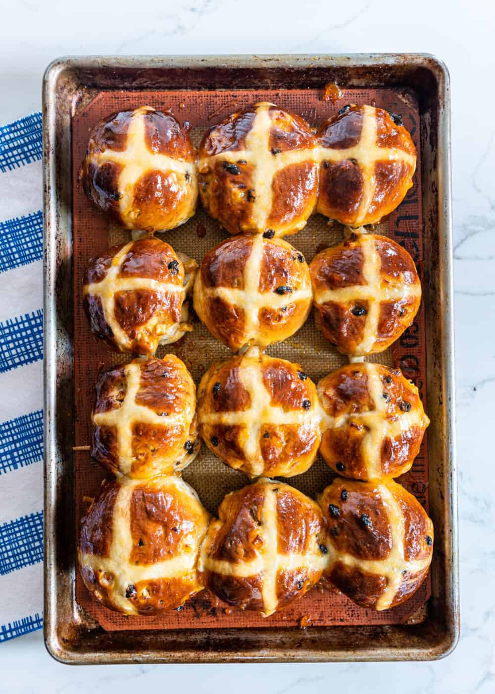 overhead shot of sheet pan of Holiday Hot Cross Buns