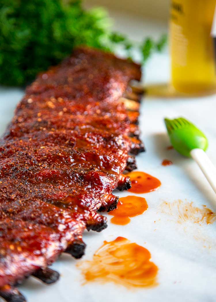 St. Louis Style Ribs with sauce dripping off them