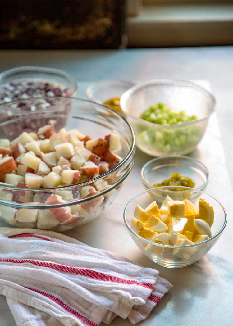 To me the classic potato salad needs to have the right balance of sweet and savory, creamy, tender yet firm potatoes, and not an overload of mayonnaise. Let me show you How to Make the Classic Potato Salad. This is your new go to version.