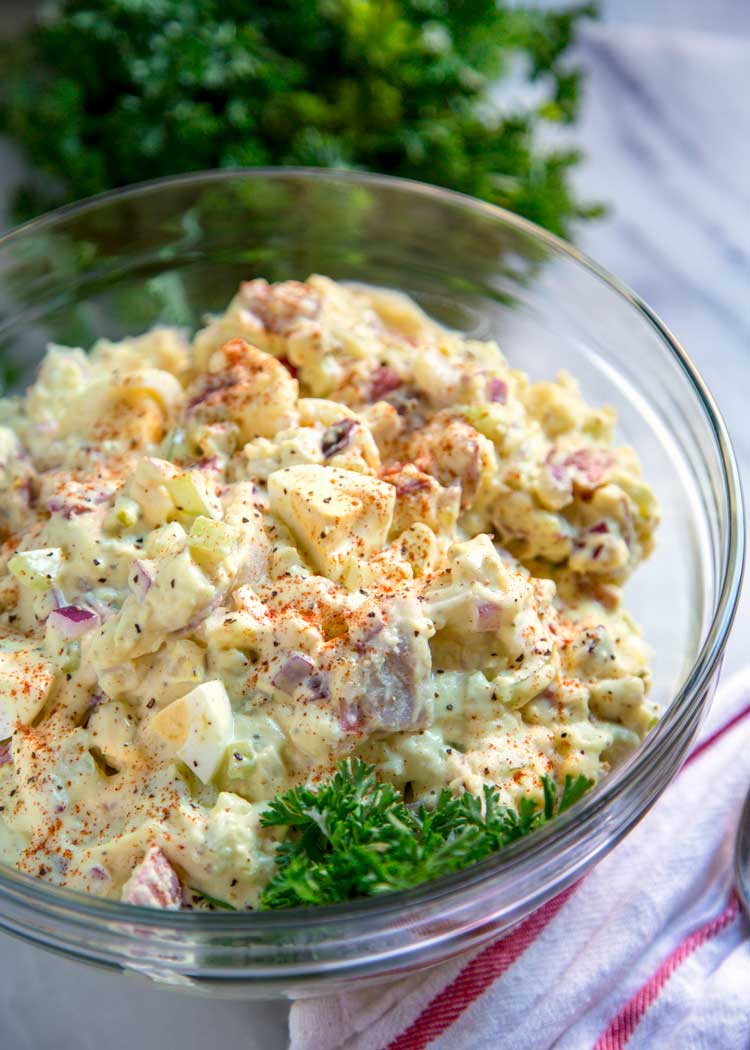 To me the classic potato salad needs to have the right balance of sweet and savory, creamy, tender yet firm potatoes, and not an overload of mayonnaise. Let me show you How to Make the Classic Potato Salad. This is your new go to version.