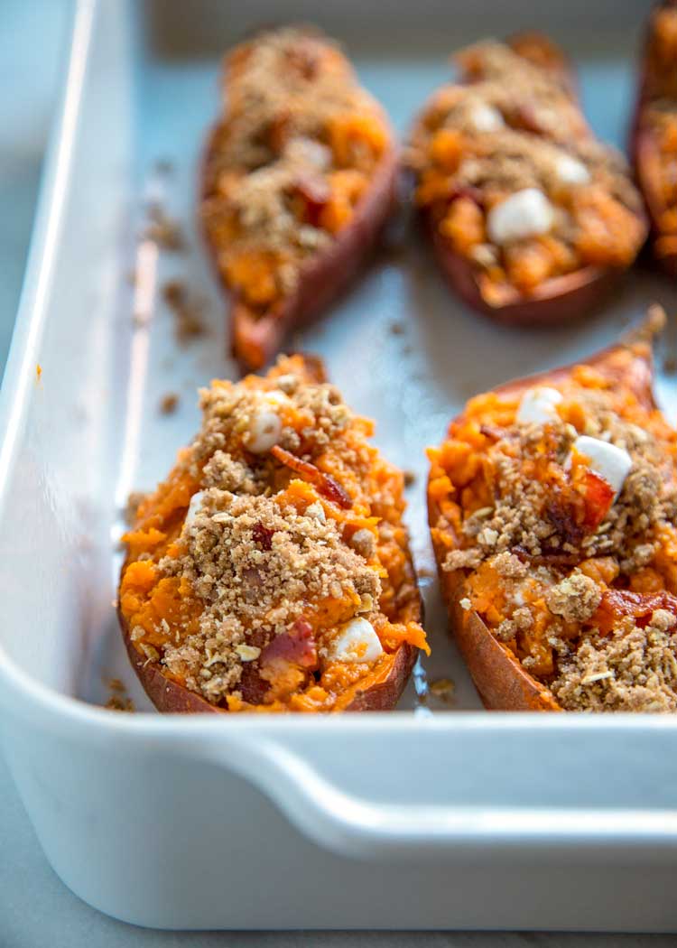 side view: twice baked sweet potato in a baking dish before baking