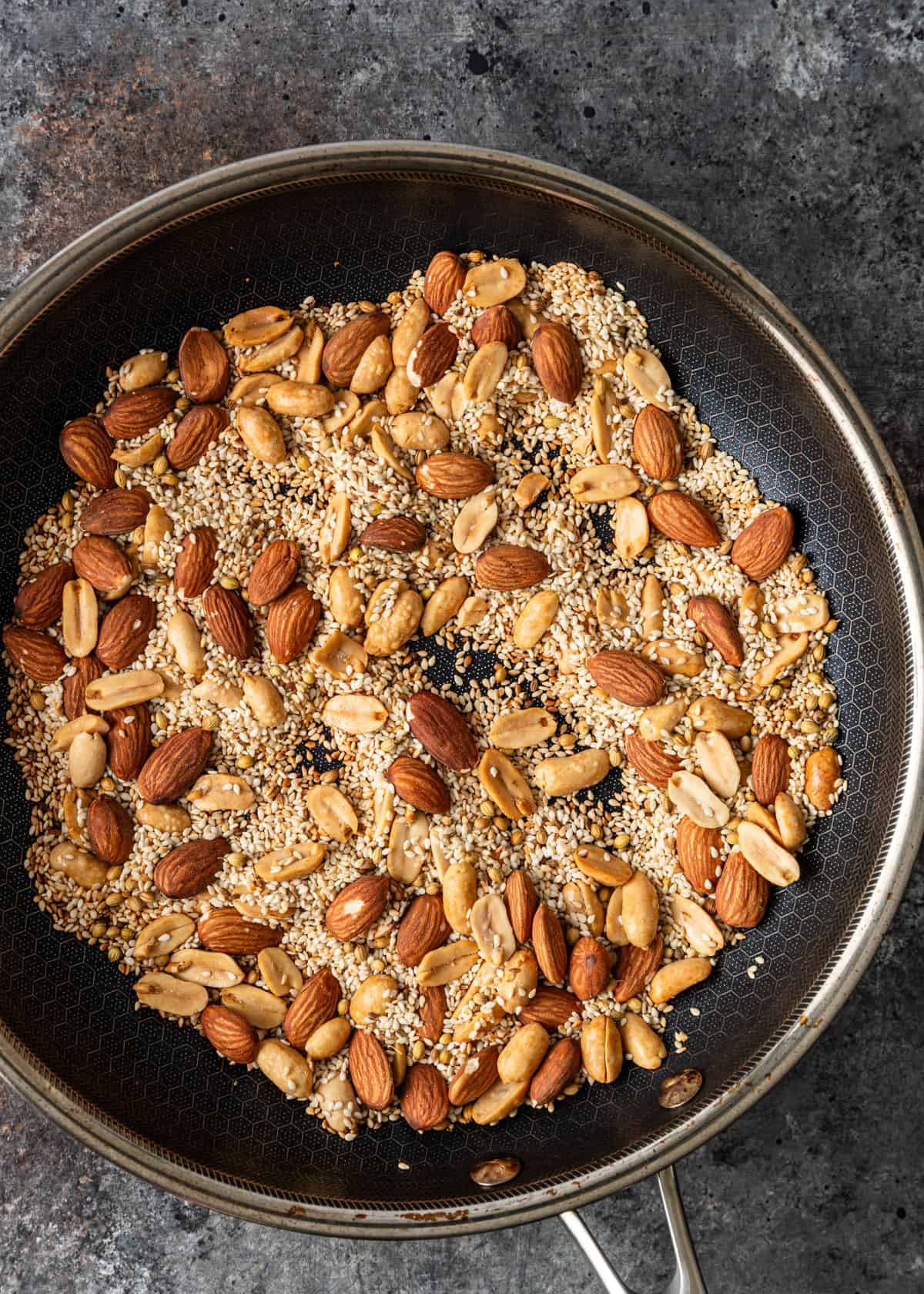 overhead process shot: toasting seeds and nuts in a skillet