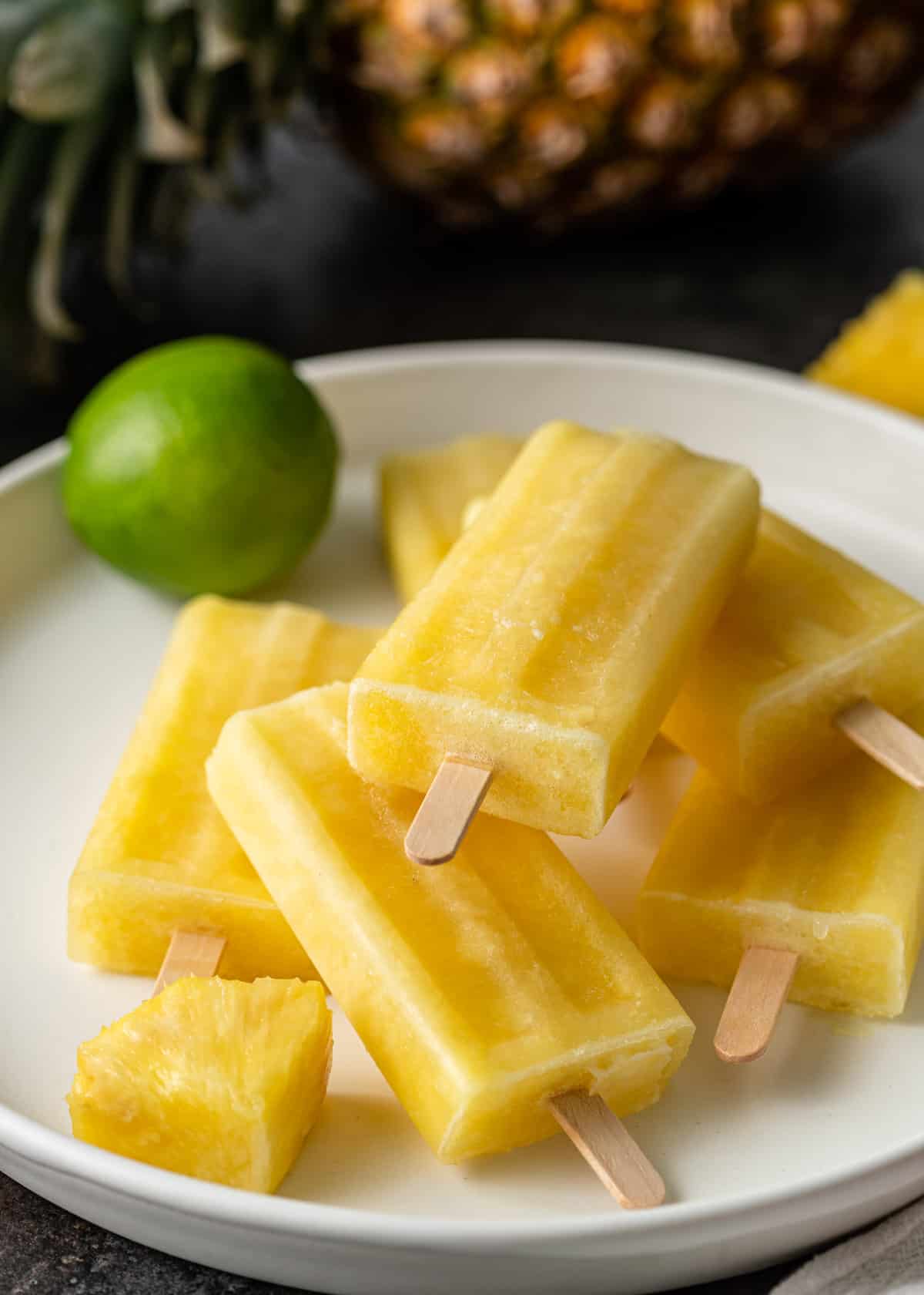 pineapple ice pops on a white plate