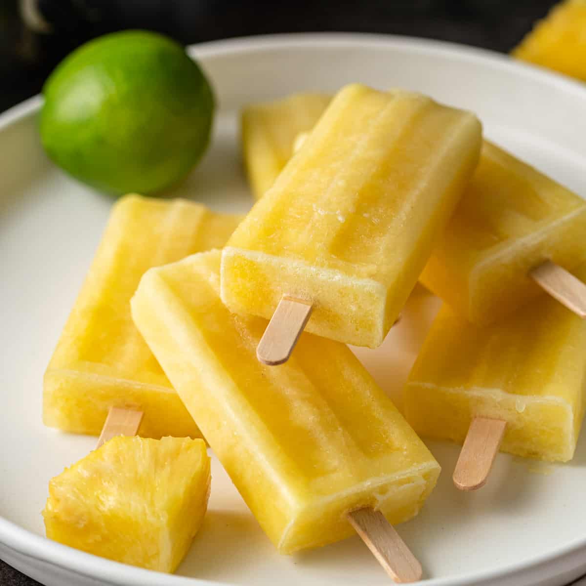 a plate of pineapple ice pops