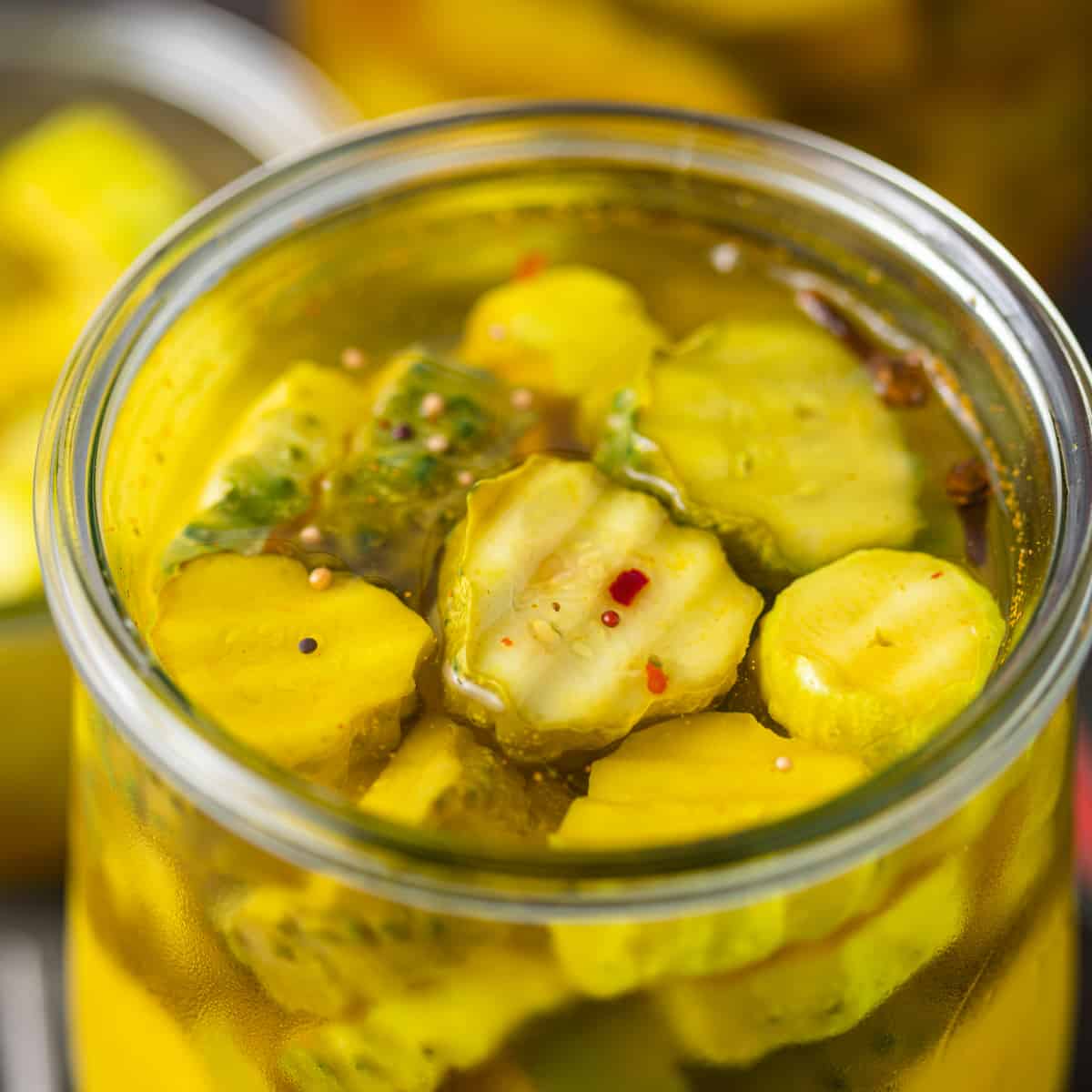 closeup: bread and butter pickle recipe in a glass jar