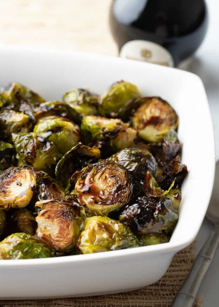 balsamic brussel sprouts in white serving dish