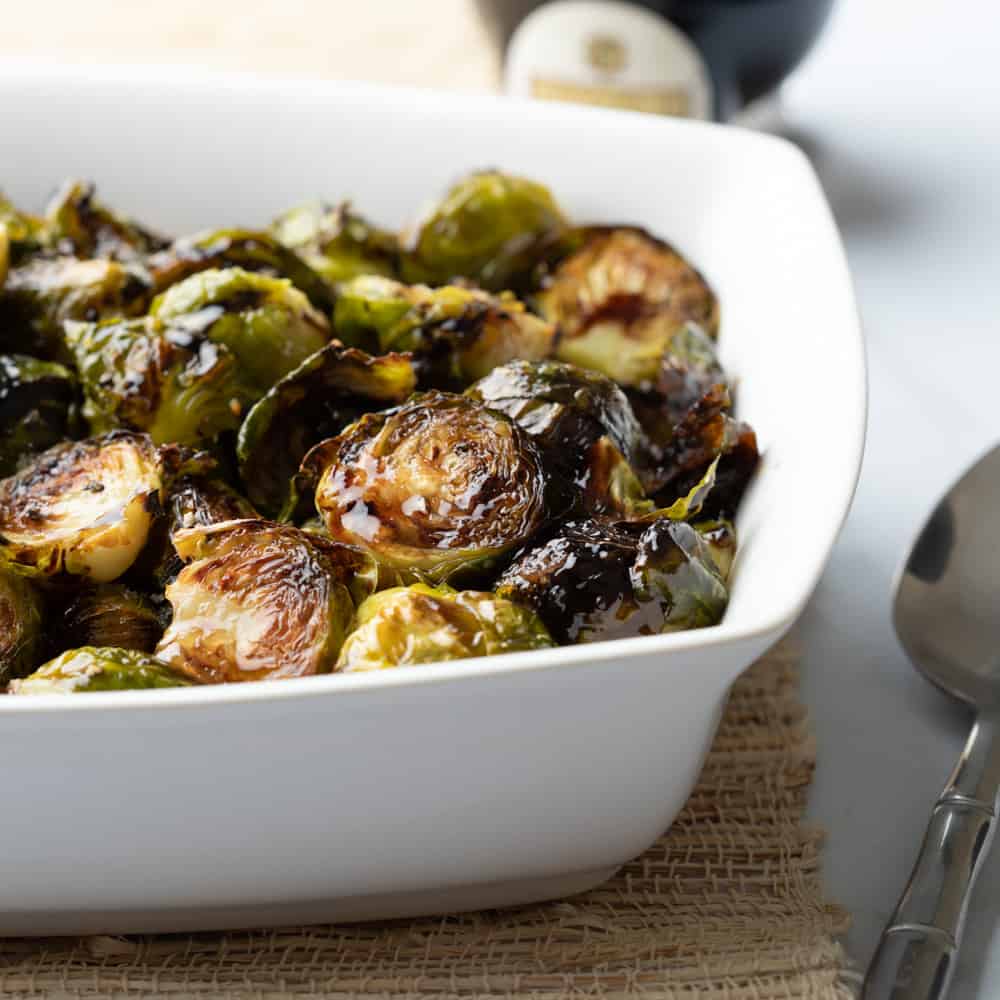 white serving dish with roasted vegetables