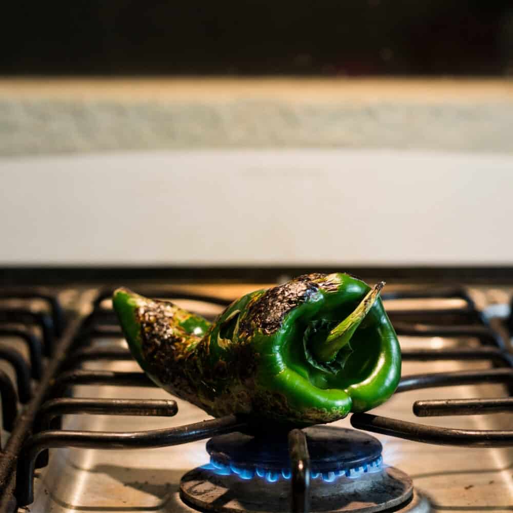 roasting poblano chile over gas flame