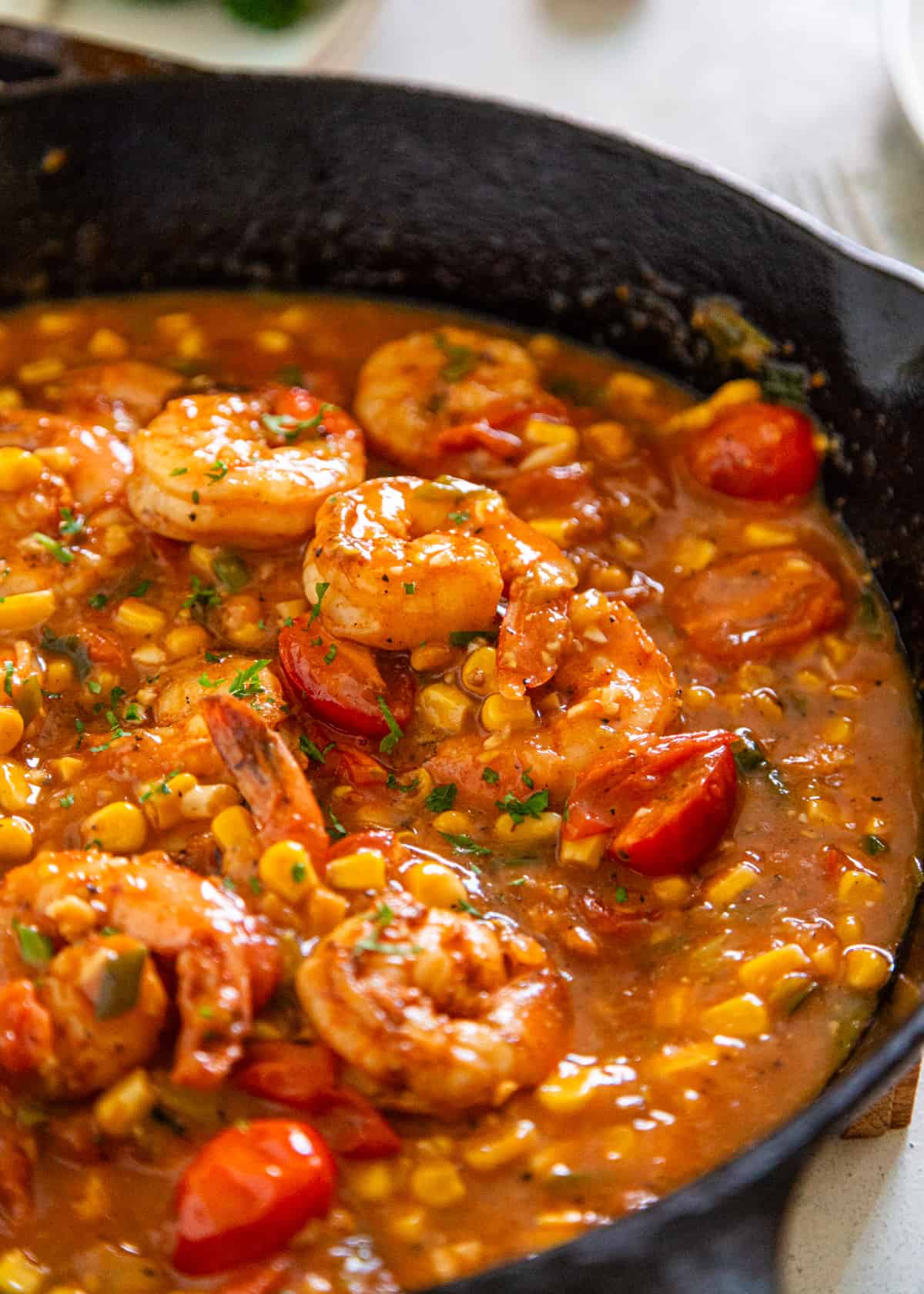 closeup: New Orleans shrimp and grits cooking in a skillet