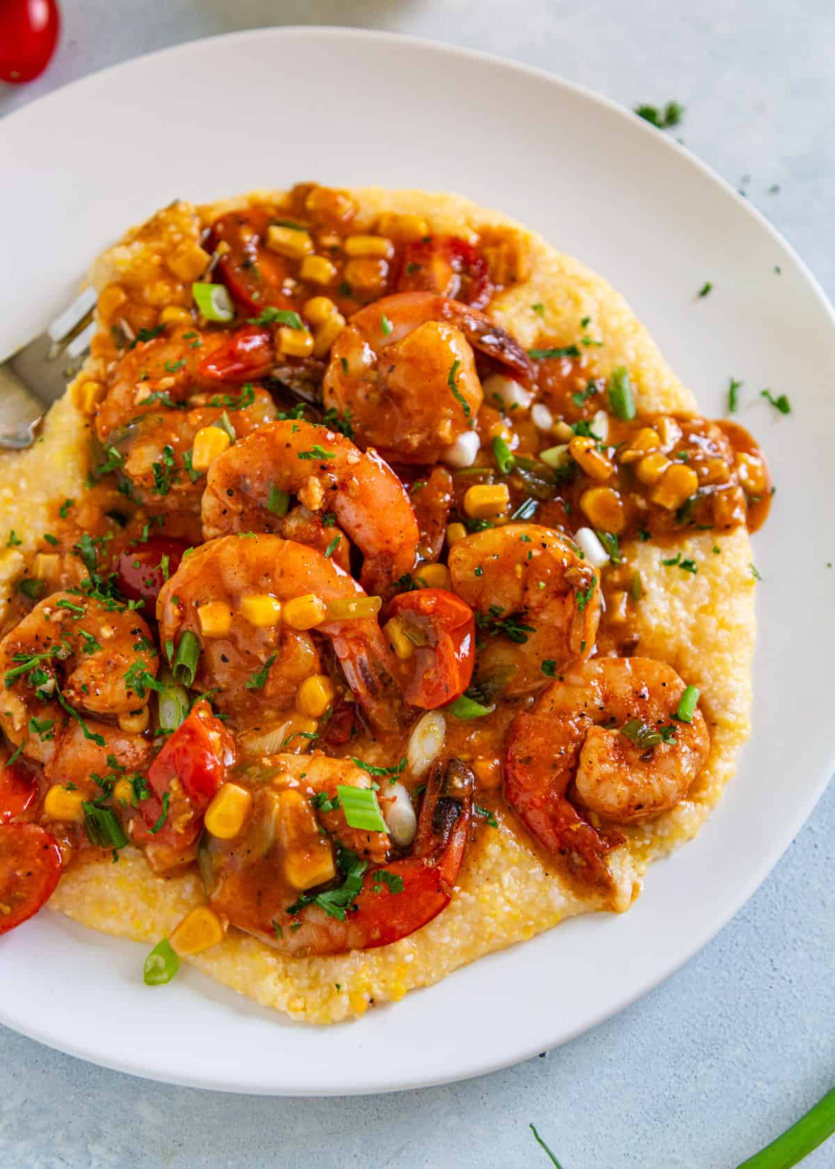 overhead: New Orleans shrimp and grits on a white plate