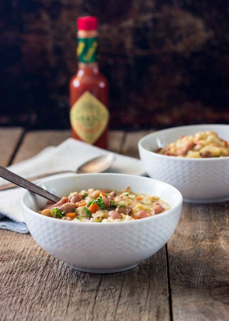 bowls filled with Slow Cooker Ham Bone Bean Soup