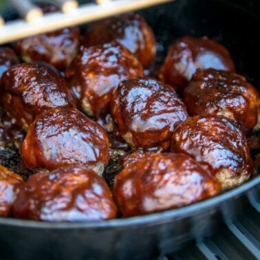 smoking meatballs in cast iron pan on grill