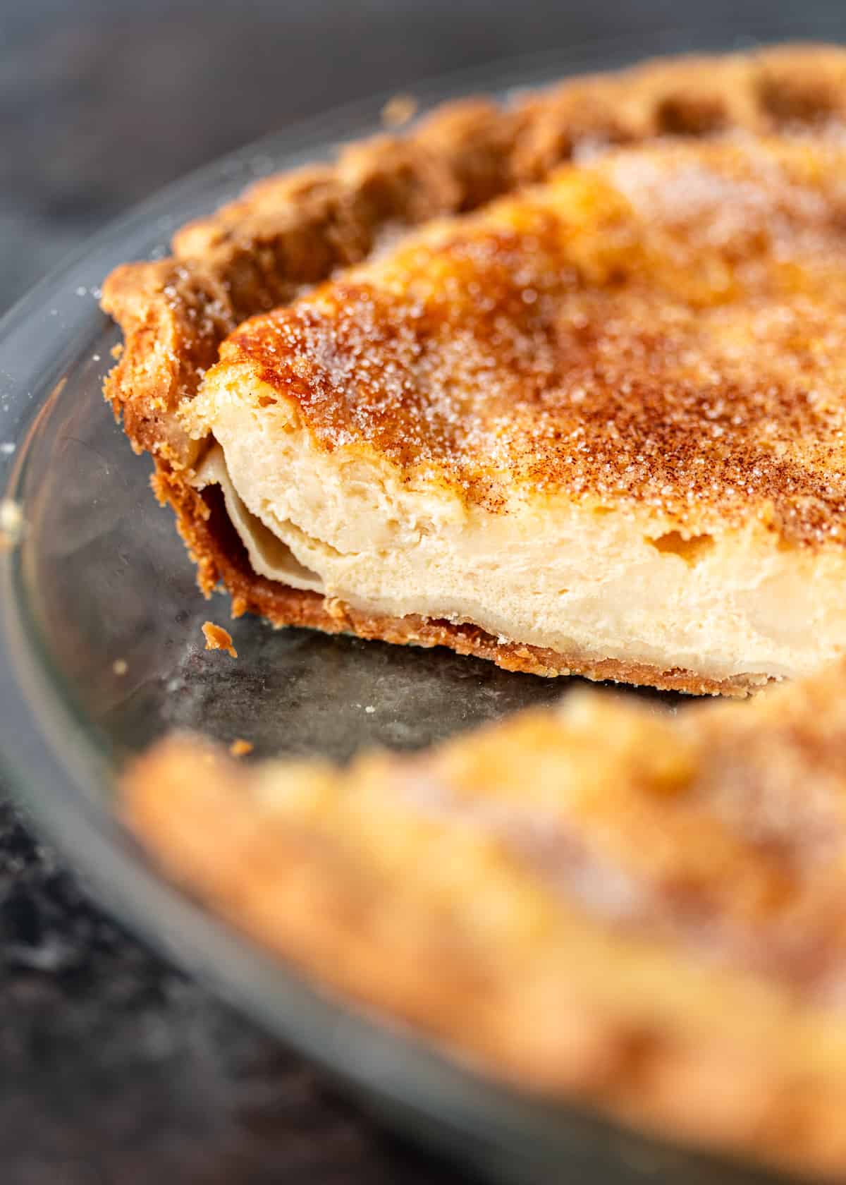 side view closeup: buttermilk pie in a pie dish with the center showing